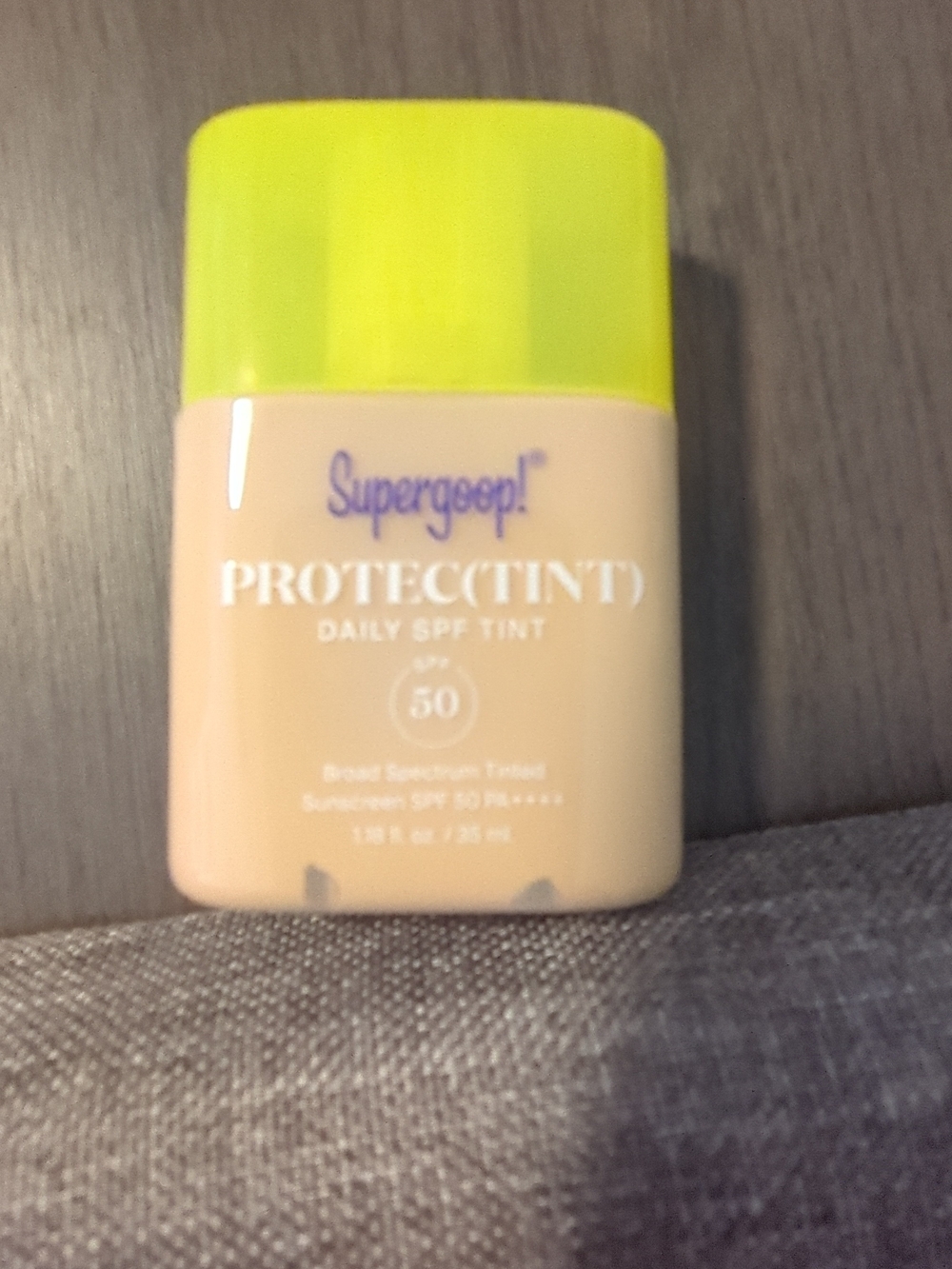 Supergoop! Tinted Daily SPF Bottle with Yellow Cap and Beige Body